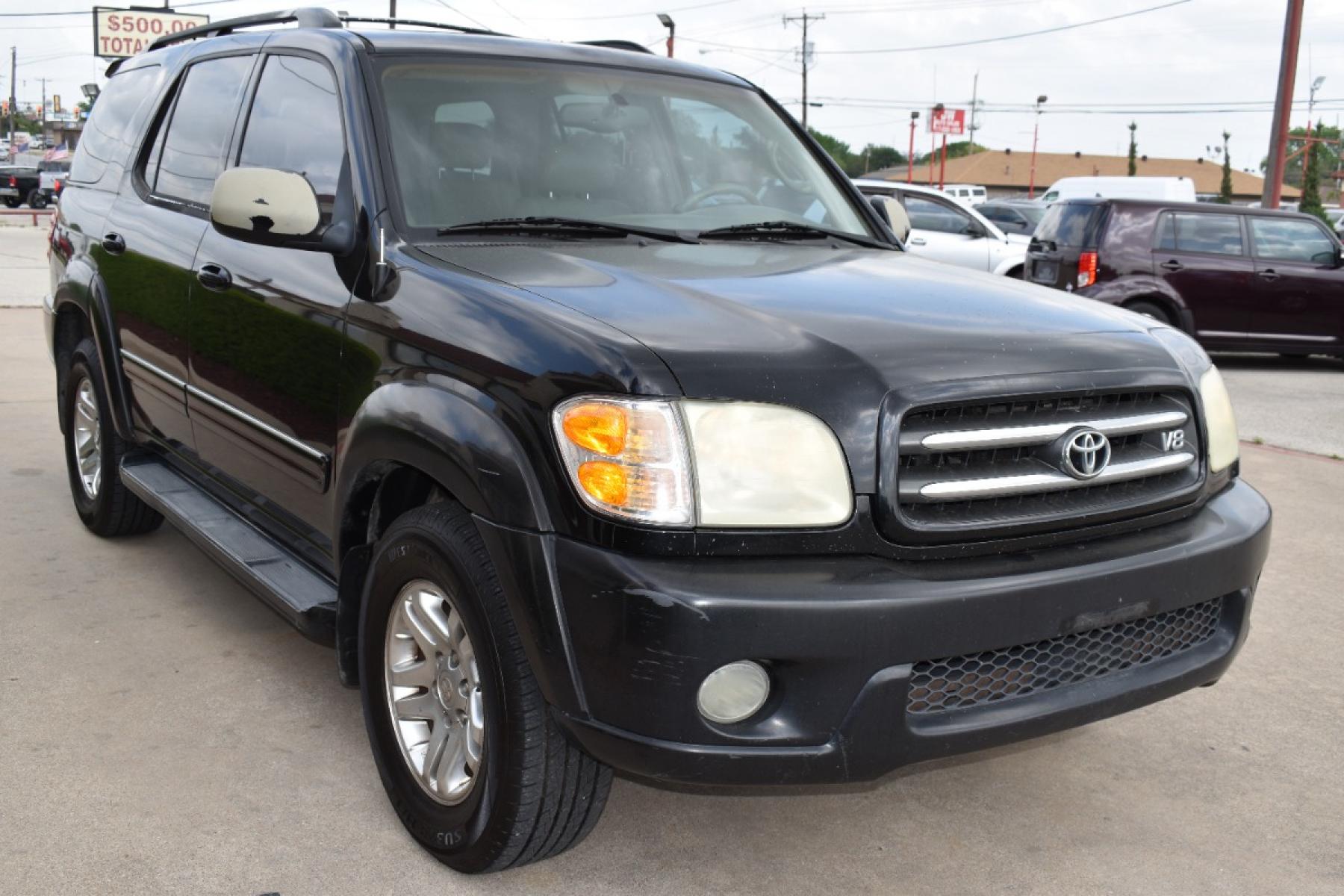 2004 Black /Black Toyota Sequoia Limited 2WD (5TDZT38A14S) with an 4.7L V8 DOHC 32V engine, 4-Speed Automatic Overdrive transmission, located at 5925 E. BELKNAP ST., HALTOM CITY, TX, 76117, (817) 834-4222, 32.803799, -97.259003 - Call 817-834-4222 NOW or Apply ONLINE ANYTIME...24/7!! All our vehicles are priced under $9K Inventory Changes Daily!! Easy, simple financing available!! We know you need reliable transportation to get you to work, home, and play. This Vehicle has a Clean Carfax Report!! Rides and Drives gre - Photo #2