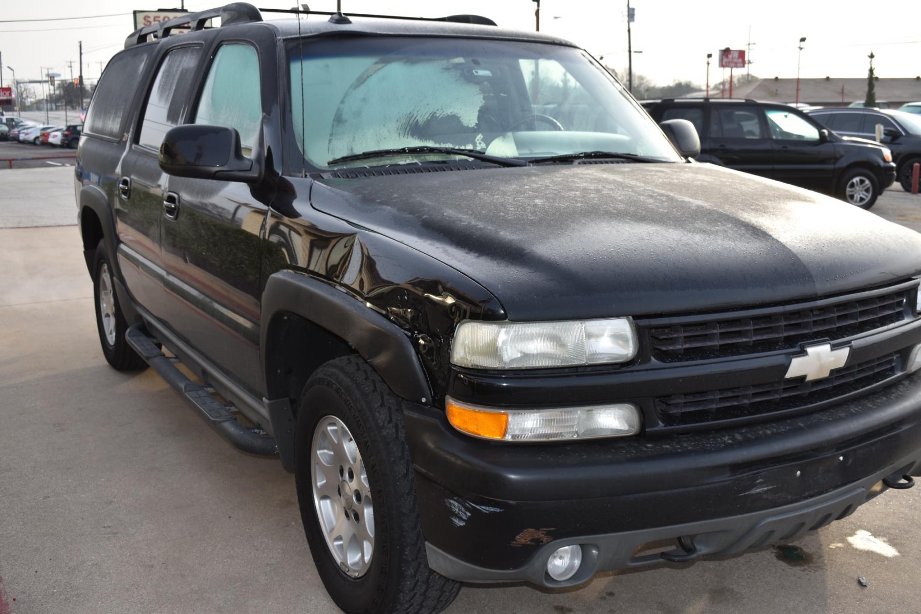 2003 Black /Beige Chevrolet Suburban 1500 4WD (3GNFK16Z13G) with an 5.3L V8 OHV 16V FFV engine, 4-Speed Automatic Overdrive transmission, located at 5925 E. BELKNAP ST., HALTOM CITY, TX, 76117, (817) 834-4222, 32.803799, -97.259003 - [Scene: A picturesque suburban neighborhood on a sunny day. The camera pans through lush lawns and beautiful homes.] Narrator (V.O.): Welcome to the heart of the suburbs, where life is all about family, adventure, and making memories that last a lifetime. [Cut to a driveway, where a well-maintaine - Photo #2