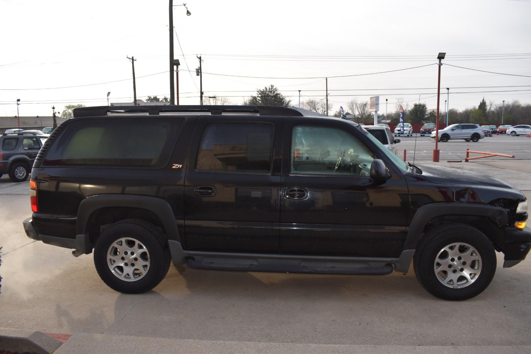 2003 Black /Beige Chevrolet Suburban 1500 4WD (3GNFK16Z13G) with an 5.3L V8 OHV 16V FFV engine, 4-Speed Automatic Overdrive transmission, located at 5925 E. BELKNAP ST., HALTOM CITY, TX, 76117, (817) 834-4222, 32.803799, -97.259003 - This Vehicle has a Clean Carfax Report!! Rides and Drives great, it just needs YOU Behind the Wheel!! Call Us at (817) 834-4222 Easy, simple financing available!! We know you need reliable transportation to get you to work, home, and play. Yet, so many people are denied the financing options that ar - Photo #3