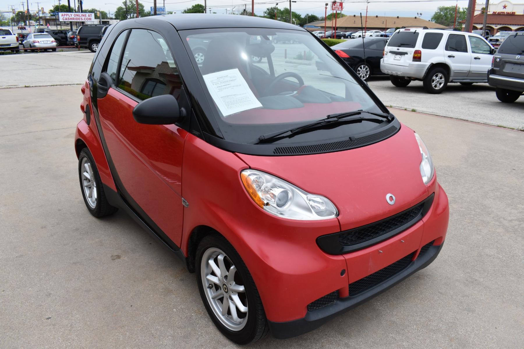 2009 Red /Red smart Fortwo Passion (WMEEJ31X69K) with an 1.0L L3 DOHC 12V engine, 5-Speed Manual transmission, located at 5925 E. BELKNAP ST., HALTOM CITY, TX, 76117, (817) 834-4222, 32.803799, -97.259003 - This Vehicle has a Clean Carfax Report!! Rides and Drives great, it just needs YOU Behind the Wheel!! Call Us at (817) 834-4222 Easy, simple financing available!! We know you need reliable transportation to get you to work, home, and play. Yet, so many people are denied the financing options that ar - Photo #1