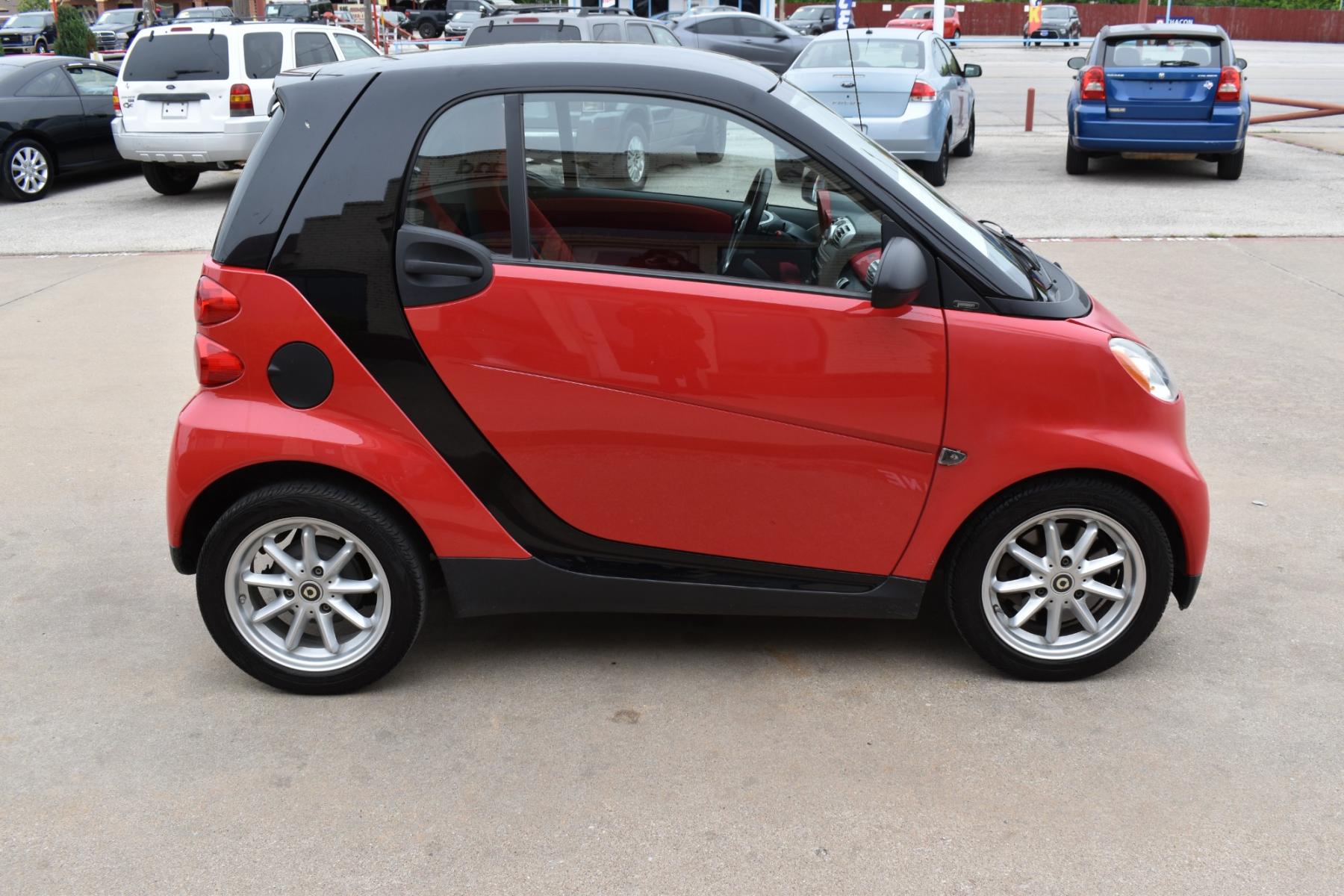 2009 Red /Red smart Fortwo Passion (WMEEJ31X69K) with an 1.0L L3 DOHC 12V engine, 5-Speed Manual transmission, located at 5925 E. BELKNAP ST., HALTOM CITY, TX, 76117, (817) 834-4222, 32.803799, -97.259003 - This Vehicle has a Clean Carfax Report!! Rides and Drives great, it just needs YOU Behind the Wheel!! Call Us at (817) 834-4222 Easy, simple financing available!! We know you need reliable transportation to get you to work, home, and play. Yet, so many people are denied the financing options that ar - Photo #2