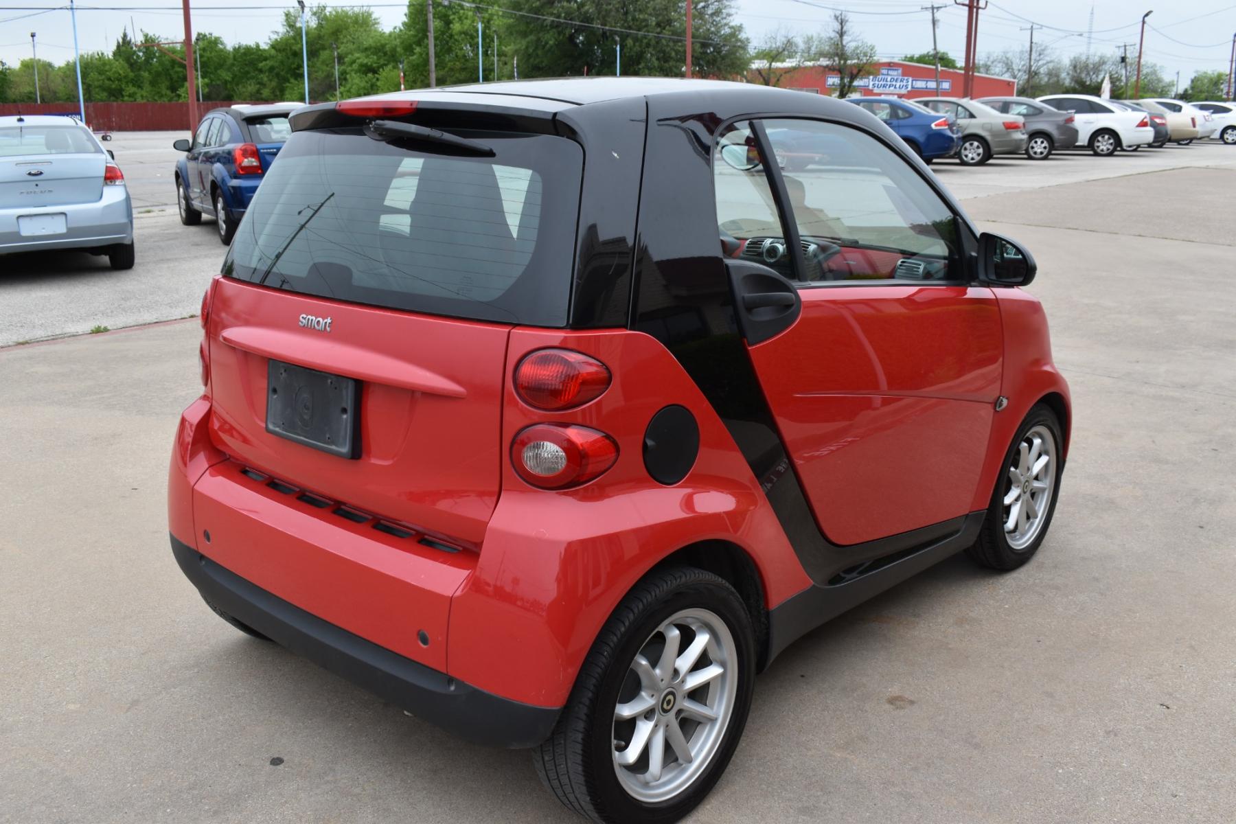 2009 Red /Red smart Fortwo Passion (WMEEJ31X69K) with an 1.0L L3 DOHC 12V engine, 5-Speed Manual transmission, located at 5925 E. BELKNAP ST., HALTOM CITY, TX, 76117, (817) 834-4222, 32.803799, -97.259003 - This Vehicle has a Clean Carfax Report!! Rides and Drives great, it just needs YOU Behind the Wheel!! Call Us at (817) 834-4222 Easy, simple financing available!! We know you need reliable transportation to get you to work, home, and play. Yet, so many people are denied the financing options that ar - Photo #3