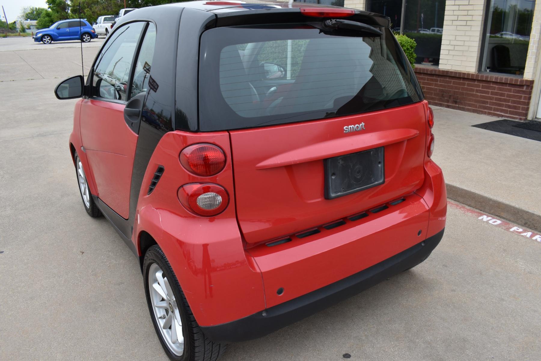 2009 Red /Red smart Fortwo Passion (WMEEJ31X69K) with an 1.0L L3 DOHC 12V engine, 5-Speed Manual transmission, located at 5925 E. BELKNAP ST., HALTOM CITY, TX, 76117, (817) 834-4222, 32.803799, -97.259003 - This Vehicle has a Clean Carfax Report!! Rides and Drives great, it just needs YOU Behind the Wheel!! Call Us at (817) 834-4222 Easy, simple financing available!! We know you need reliable transportation to get you to work, home, and play. Yet, so many people are denied the financing options that ar - Photo #4