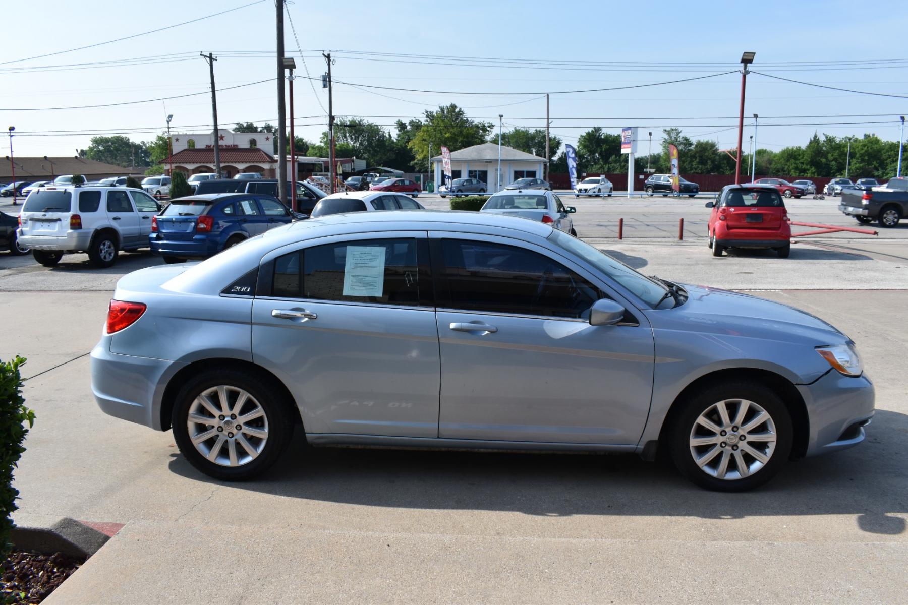 2013 Blue /Black Chrysler 200 Touring (1C3CCBBB5DN) with an 2.4L L4 DOHC 16V engine, 6-Speed Automatic transmission, located at 5925 E. BELKNAP ST., HALTOM CITY, TX, 76117, (817) 834-4222, 32.803799, -97.259003 - Photo #3