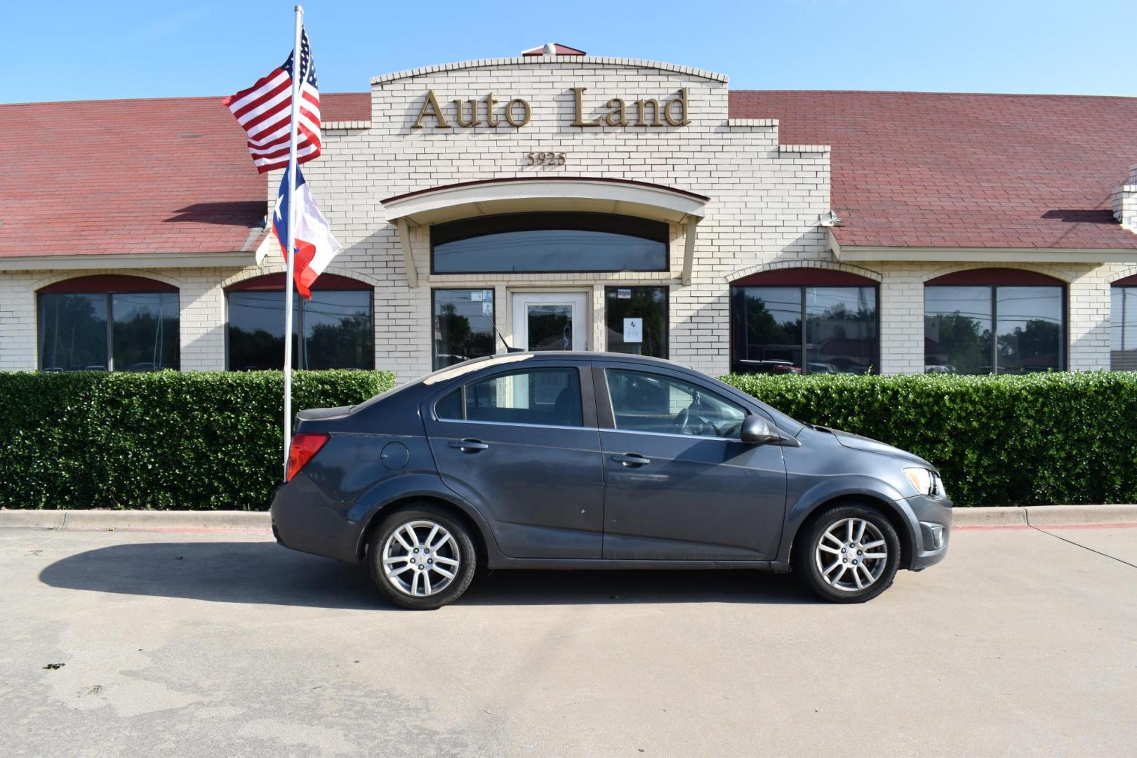 2012 Black /Gray Chevrolet Sonic (1G1JC5SH9C4) with an 4.1.8L engine, 6-Speed Automatic transmission, located at 5925 E. BELKNAP ST., HALTOM CITY, TX, 76117, (817) 834-4222, 32.803799, -97.259003 - The 2012 Chevrolet Sonic offers several benefits. Here are a few: 1. Fuel Efficiency: The Sonic is known for its impressive fuel efficiency, making it a cost-effective choice for daily commuting and long drives. 2. Compact Size: The Sonic's compact size makes it easy to maneuver in tight city stre - Photo#2