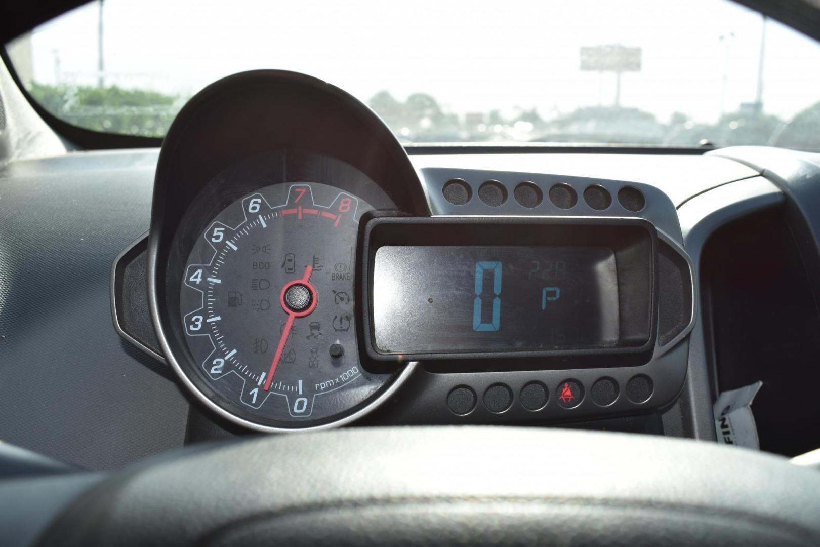 2012 Black /Gray Chevrolet Sonic (1G1JC5SH9C4) with an 4.1.8L engine, 6-Speed Automatic transmission, located at 5925 E. BELKNAP ST., HALTOM CITY, TX, 76117, (817) 834-4222, 32.803799, -97.259003 - The 2012 Chevrolet Sonic offers several benefits. Here are a few: 1. Fuel Efficiency: The Sonic is known for its impressive fuel efficiency, making it a cost-effective choice for daily commuting and long drives. 2. Compact Size: The Sonic's compact size makes it easy to maneuver in tight city stre - Photo#10