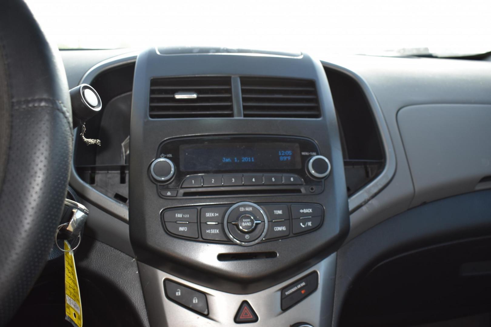2012 Black /Gray Chevrolet Sonic (1G1JC5SH9C4) with an 4.1.8L engine, 6-Speed Automatic transmission, located at 5925 E. BELKNAP ST., HALTOM CITY, TX, 76117, (817) 834-4222, 32.803799, -97.259003 - The 2012 Chevrolet Sonic offers several benefits. Here are a few: 1. Fuel Efficiency: The Sonic is known for its impressive fuel efficiency, making it a cost-effective choice for daily commuting and long drives. 2. Compact Size: The Sonic's compact size makes it easy to maneuver in tight city stre - Photo#11