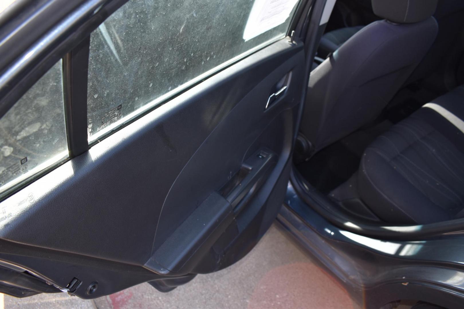 2012 Black /Gray Chevrolet Sonic (1G1JC5SH9C4) with an 4.1.8L engine, 6-Speed Automatic transmission, located at 5925 E. BELKNAP ST., HALTOM CITY, TX, 76117, (817) 834-4222, 32.803799, -97.259003 - The 2012 Chevrolet Sonic offers several benefits. Here are a few: 1. Fuel Efficiency: The Sonic is known for its impressive fuel efficiency, making it a cost-effective choice for daily commuting and long drives. 2. Compact Size: The Sonic's compact size makes it easy to maneuver in tight city stre - Photo#18
